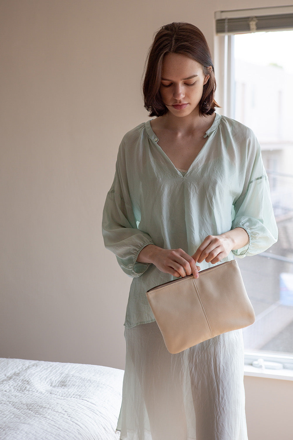 Elke Leather Zip Clutch In Porcelain