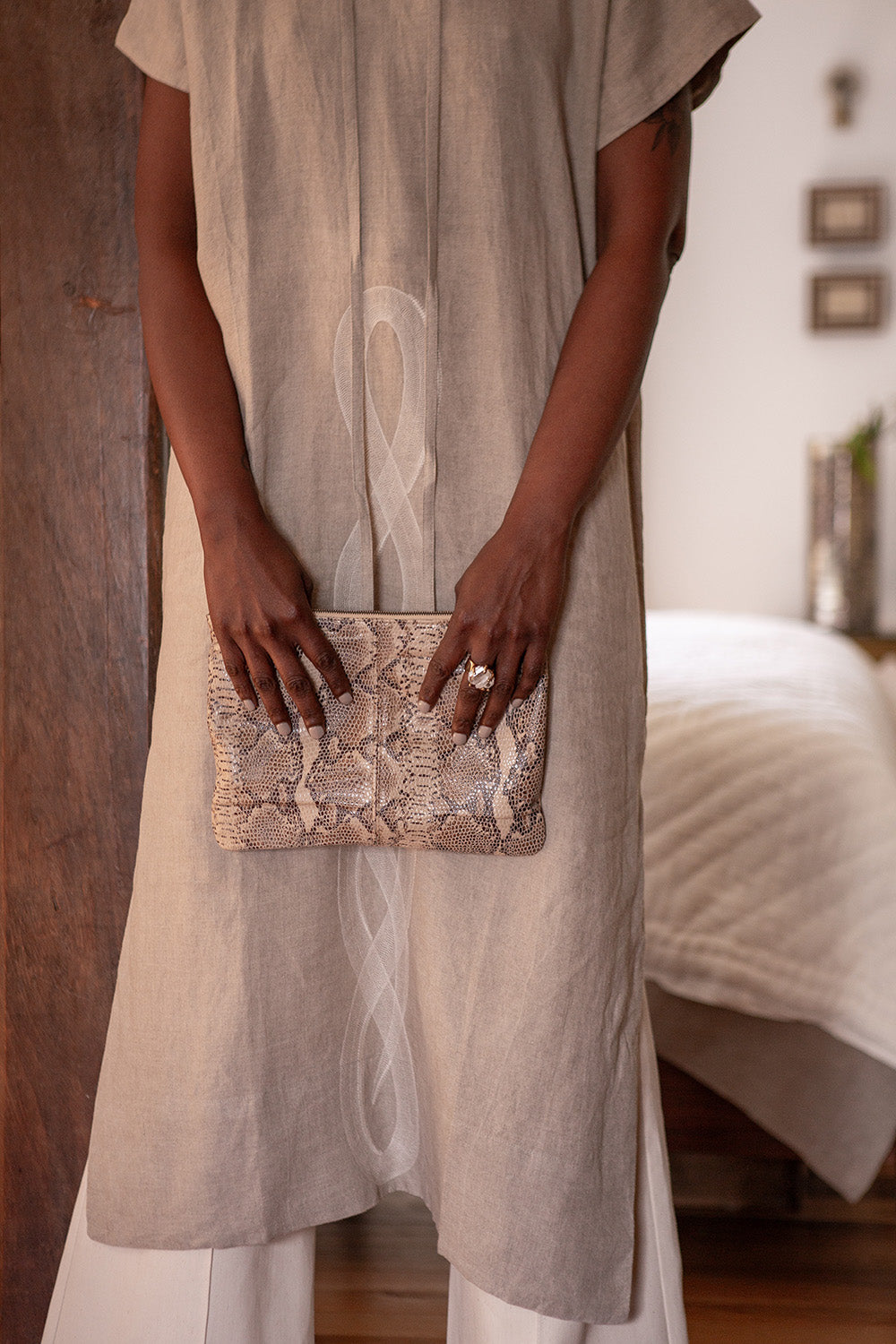 Elke Lambskin Leather Zip Clutch In Sand Snake