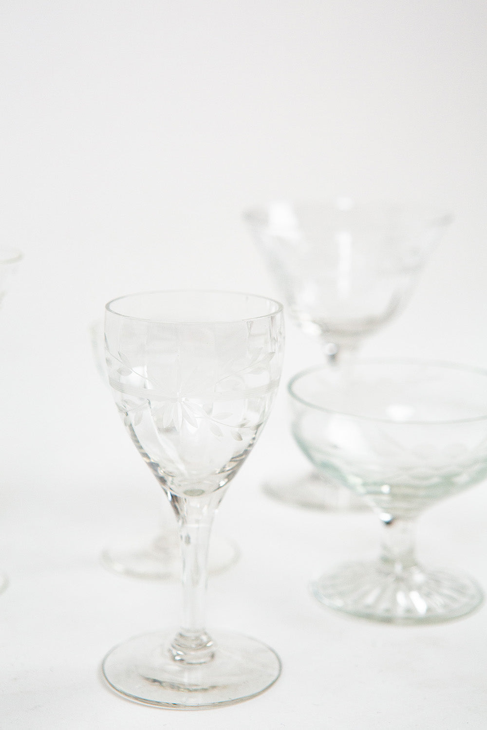 Three clear glass drinking glasses on a white background