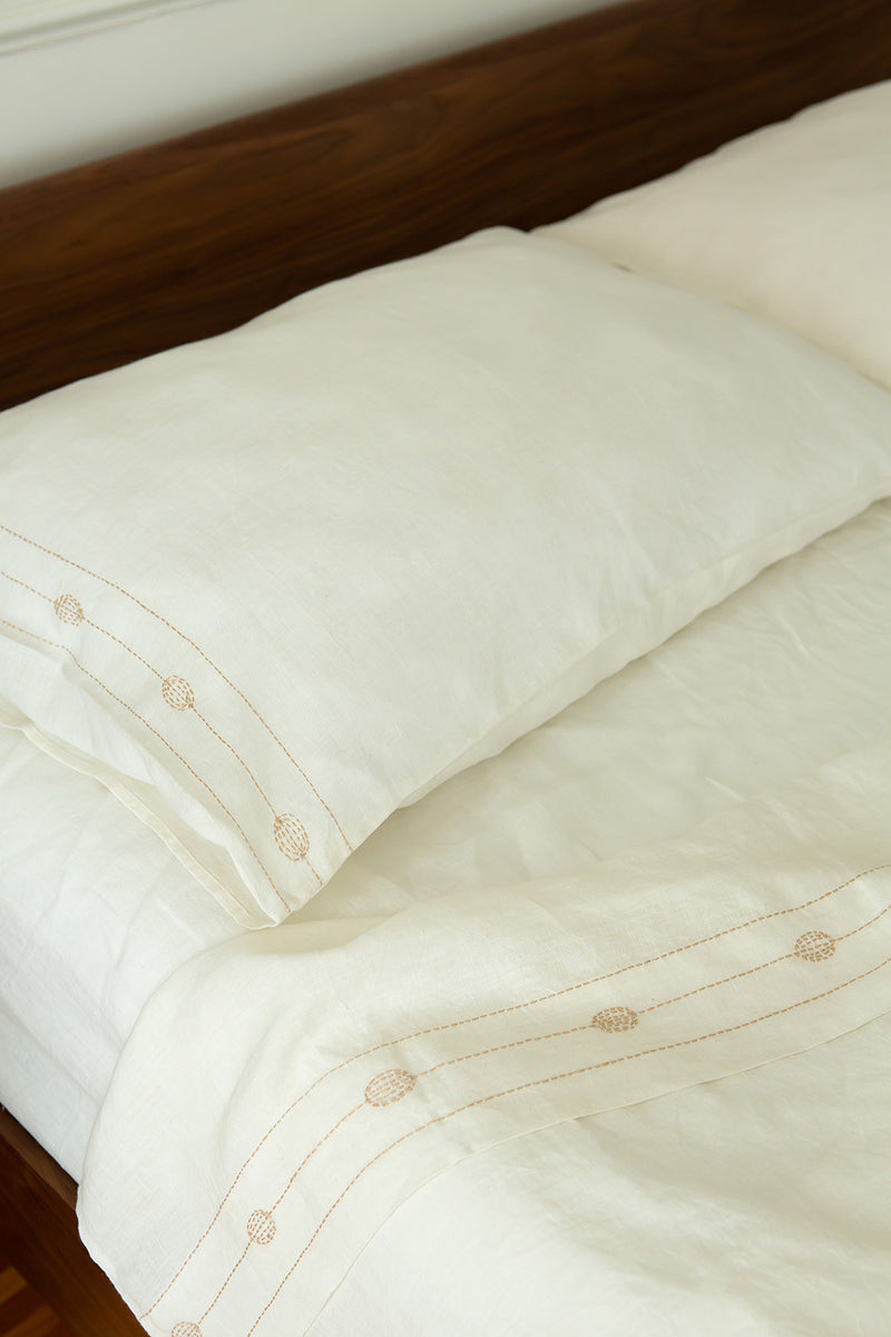 Totem Pillowcases in Hand-embroidered Soft White Linen
